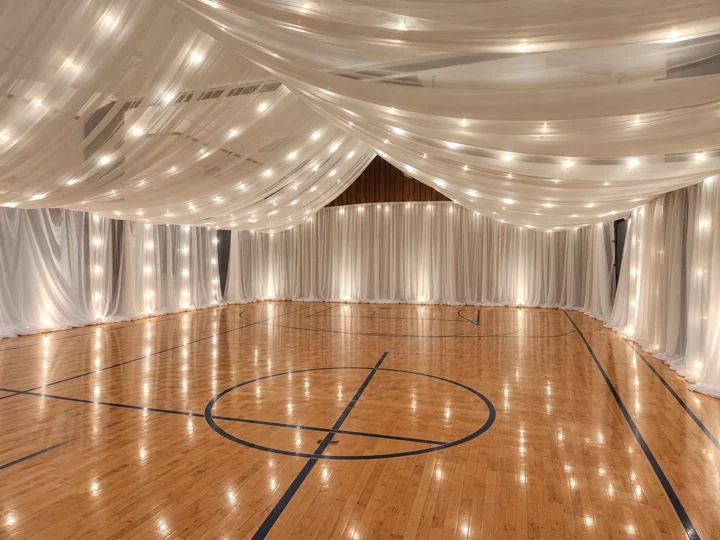 Edited BSS open-room example showing canopy, both long side walls, string lights and one draped end wall, without tables or chairs.