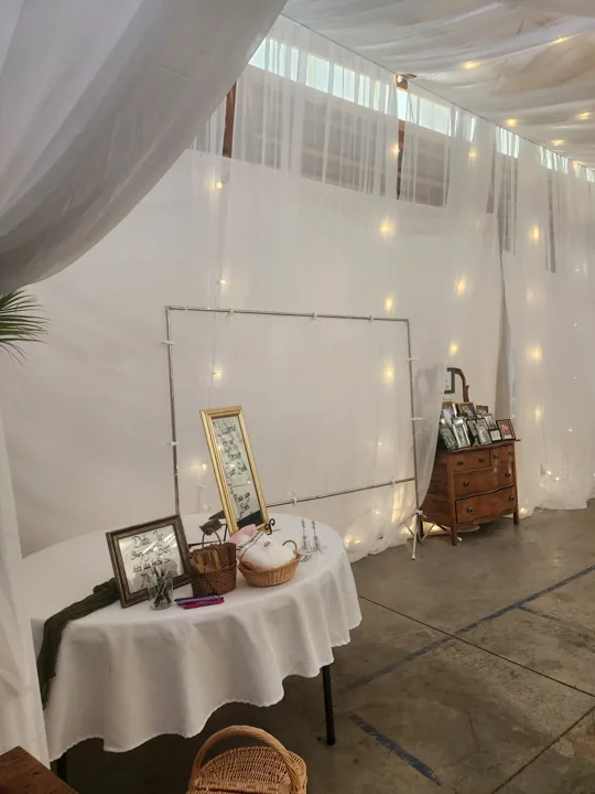 A portrait display alongside the finished reception setting.