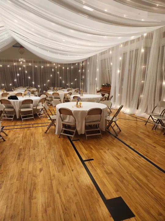 The finished Middleton reception with dressed tables beneath the canopy.