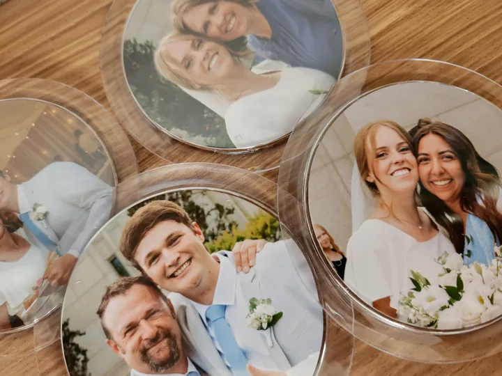 Round photo magnets displayed as personalized event keepsakes.