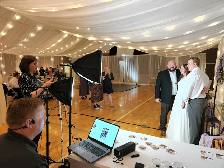 Guests at the live keepsake station during a reception.